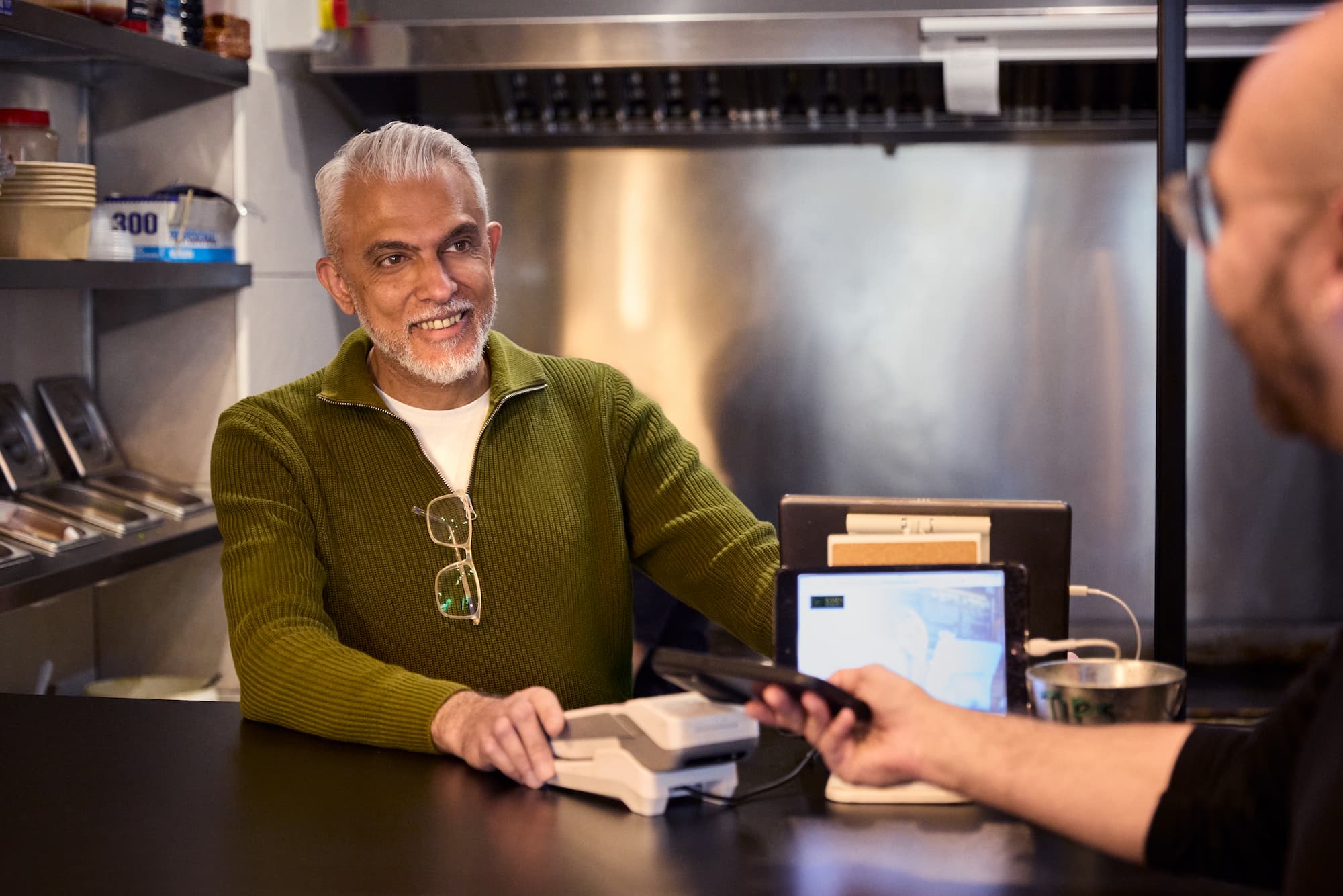 man paying at the cafe