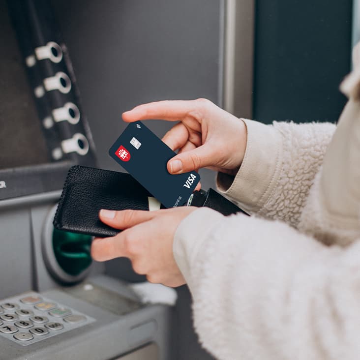 Person withdrawing from the cash machine
