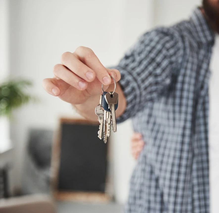 Person holding keys.